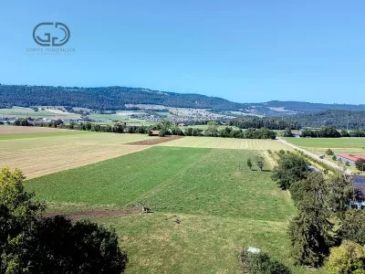 Terrain à bâtir en bordure de zone agricole